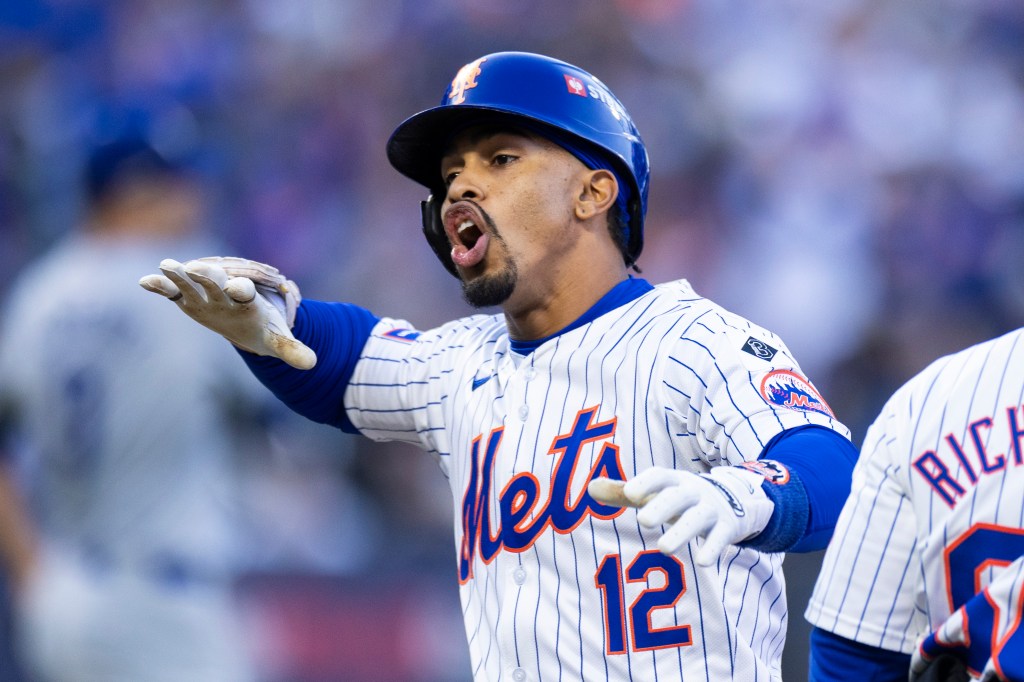 Francisco Lindor of the New York Mets reacts after he hits a single during the first inning of Game 5 of the NLCS at Citi Field, Friday, Oct. 18, 2024.