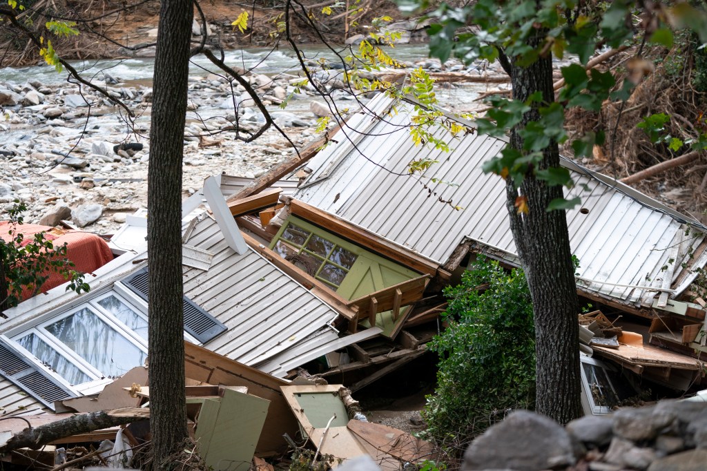 A destroyed house lies next to the Broad River after Hurricane Helene on Oct. 1, 2024 in Bat Cave, North Carolina.