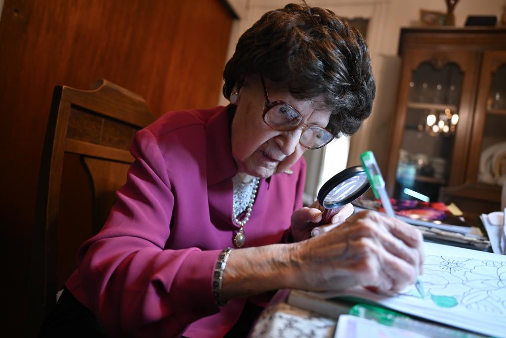 Josephin Nigro, 101, working on a coloring book in her home in Brooklyn.