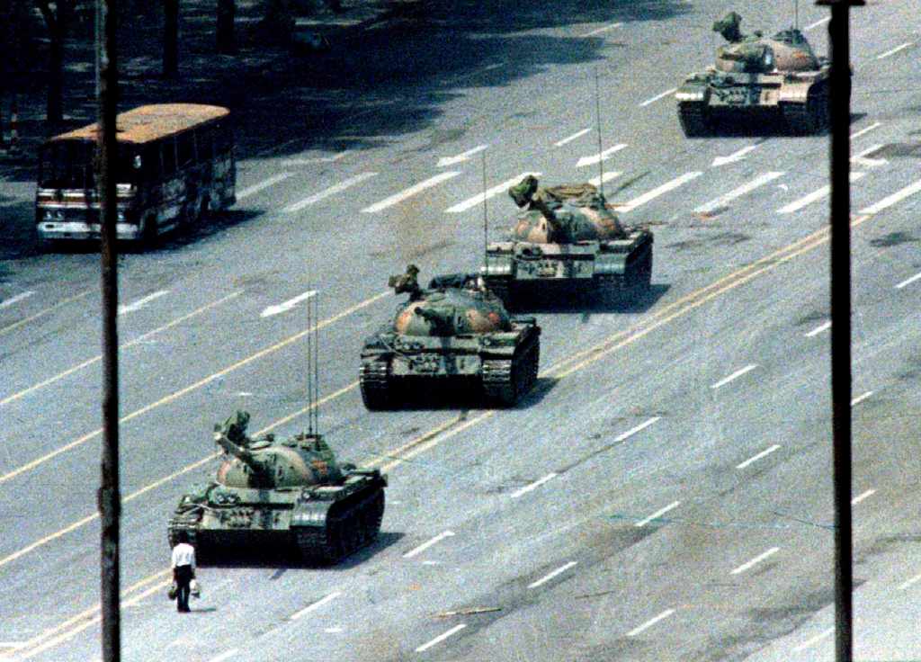 Famous image of a student protester facing down a row of Chinese tanks in Tiananmen Square.