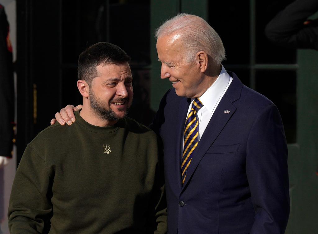 Joe Biden hugs President of Ukraine Volodymyr Zelensky.