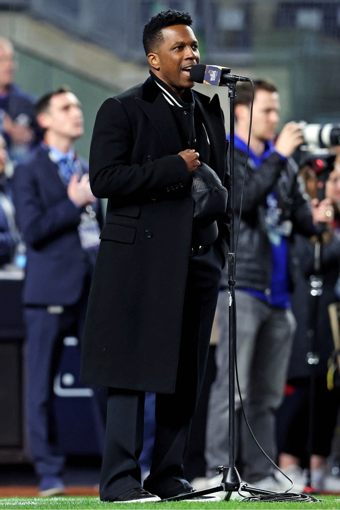 Recording artist Leslie Odom Jr. performs the national anthem before Game 3. 