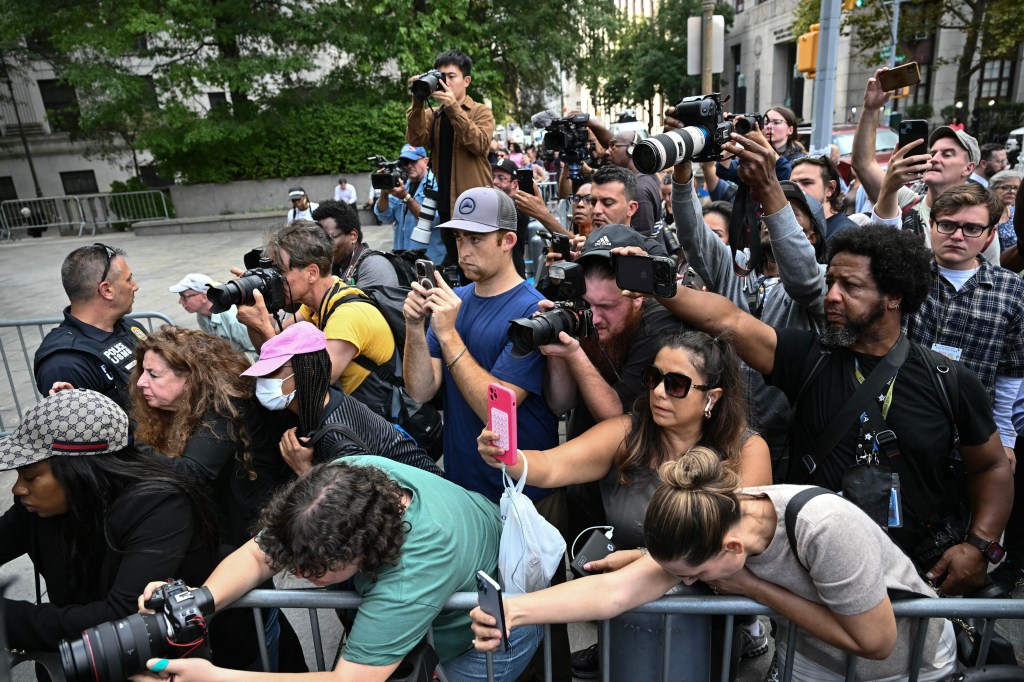 Members of the media gather as they listen to a press conference with Marc Agnifilo, lawyer for rapper and music producer Sean "Diddy" Combs, outside federal court after Combs' arraignment hearing on September 17, 2024, in New York.