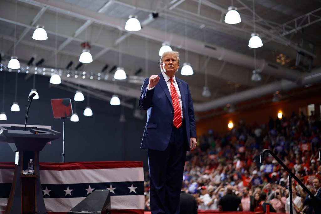 Donald Trump acknowledges his audience at the conclusion of a campaign event at the Rocky Mount Event Center on October 30, 2024 in Rocky Mount, North Carolina. 