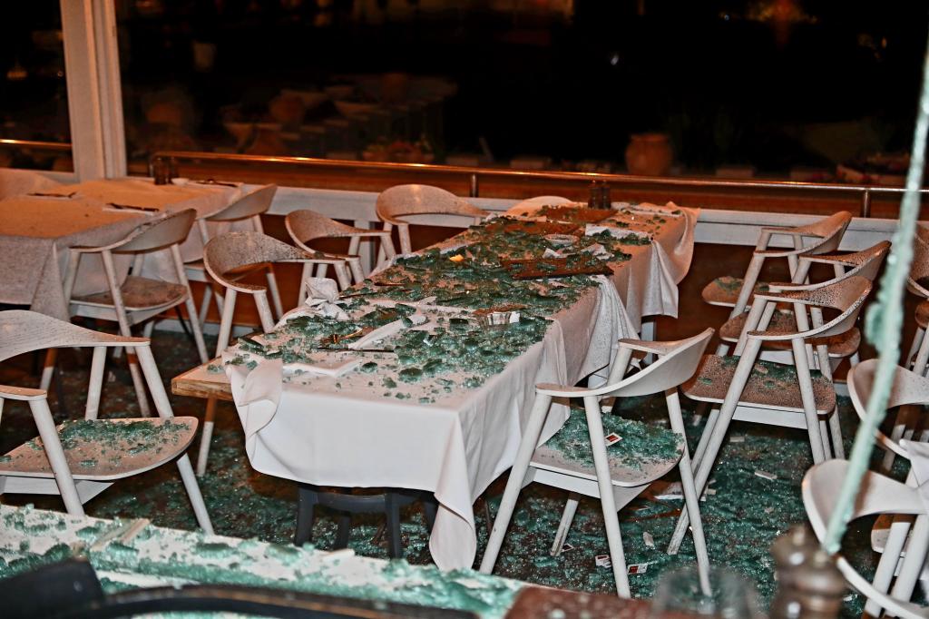 Restaurant in Tel Aviv, Israel damaged by missile attacks as shown by broken glass on table, taken on October 1, 2024