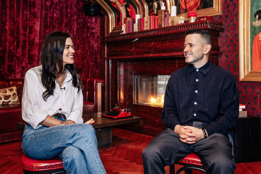 Lydia Moynihan and Eugene Remm sitting and conversing in the Red Room at Catch Steak in Manhattan, photographed on October 2, 2024.