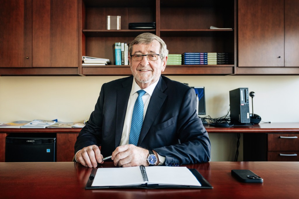 Michael Dowling sitting at a desk at Northwell's Corporate Headquarters in Manhattan, taken on October 9, 2024, photo by Emmy Park for NY Post.