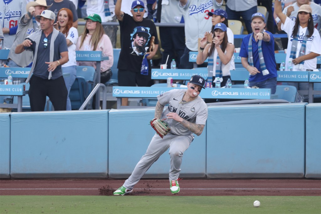 New York Yankees outfielder Alex Verdugo (24) runs for the ball in the first inning against the Los Angeles Dodgers  during game one of the 2024 MLB World Series at Dodger Stadium.