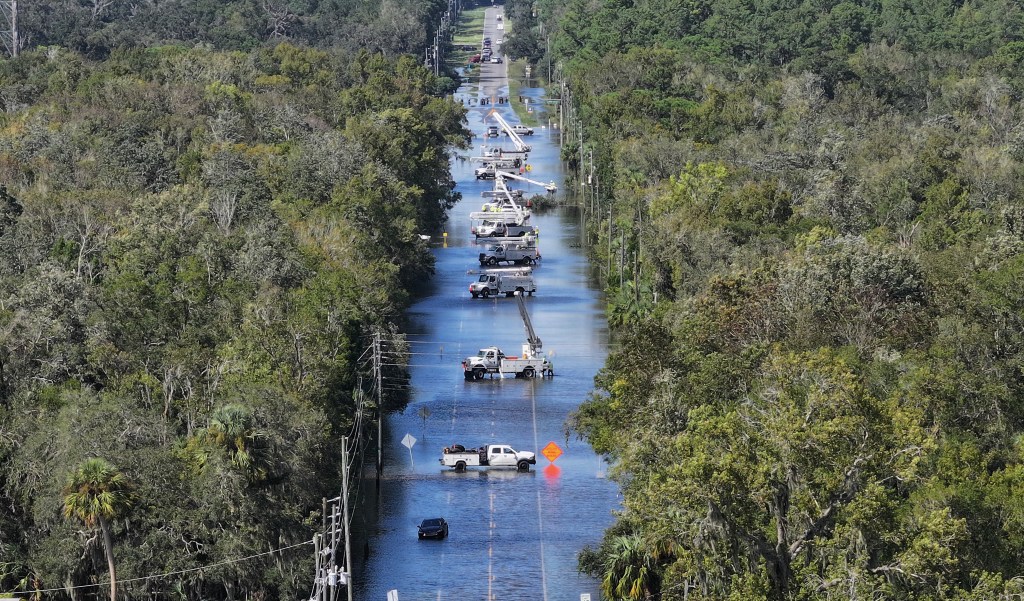 In this aerial view, power crews work on the lines after Hurricane Helene passed offshore on September 27, 2024 in Crystal River, Florida. 