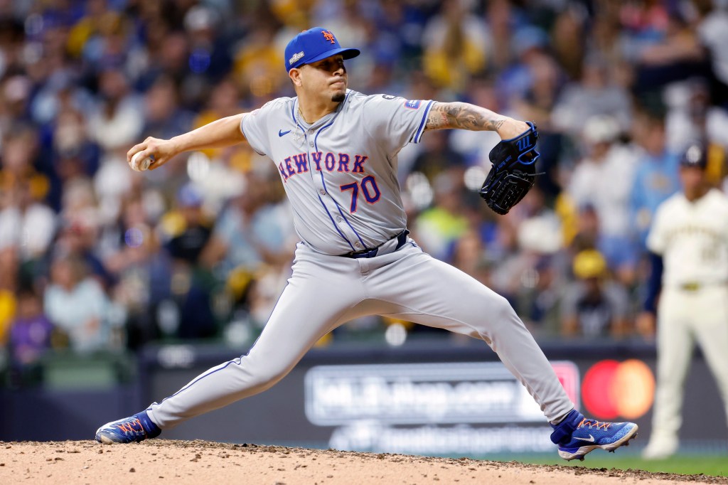 José Buttó #70 of the New York Mets pitches in the seventh inning against the Milwaukee Brewers during Game 1 of the Wild Card Series at American Family Field on October 01, 2024 in Milwaukee, Wisconsin.