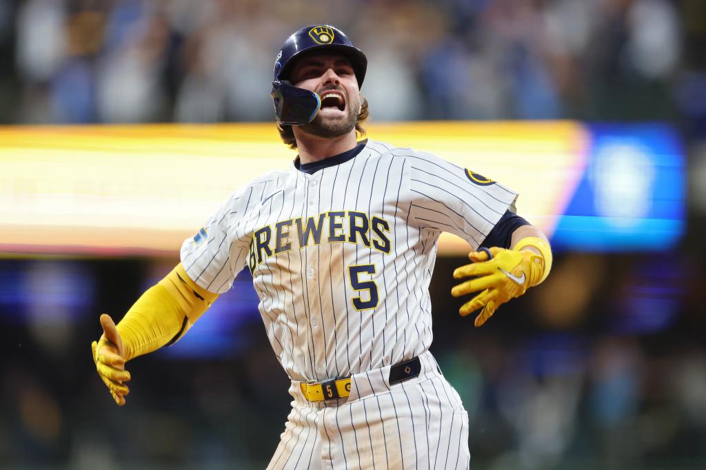 Garrett Mitchell #5 of the Milwaukee Brewers celebrates after hitting a home run in the eighth inning against the New York Mets during Game Two of the Wild Card Series at American Family Field on October 02, 2024 in Milwaukee, Wisconsin.