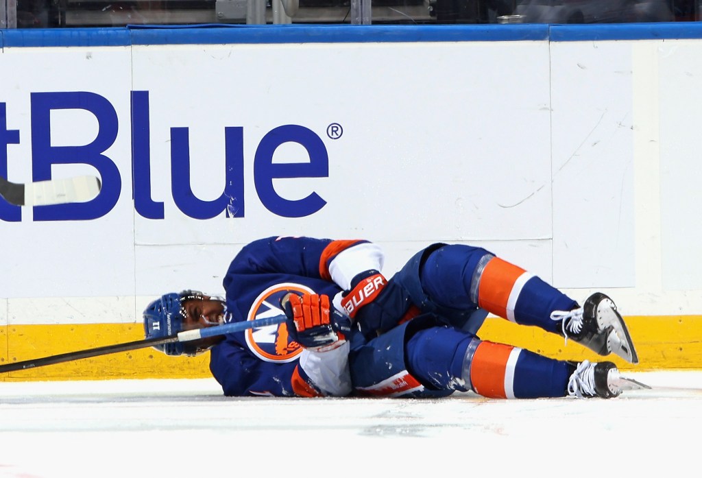 Anthony Duclair #11 of the New York Islanders is injured during the third period against the Montreal Canadiens at UBS Arena on October 19, 2024 in Elmont, New York. 