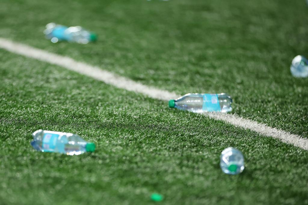 Texas Longhorns fans throw bottles onto the field after a defensive pass interference call overturned an interception against the Georgia Bulldogs during the third quarter at Darrell K Royal-Texas Memorial Stadium on October 19, 2024 in Austin, Texas.