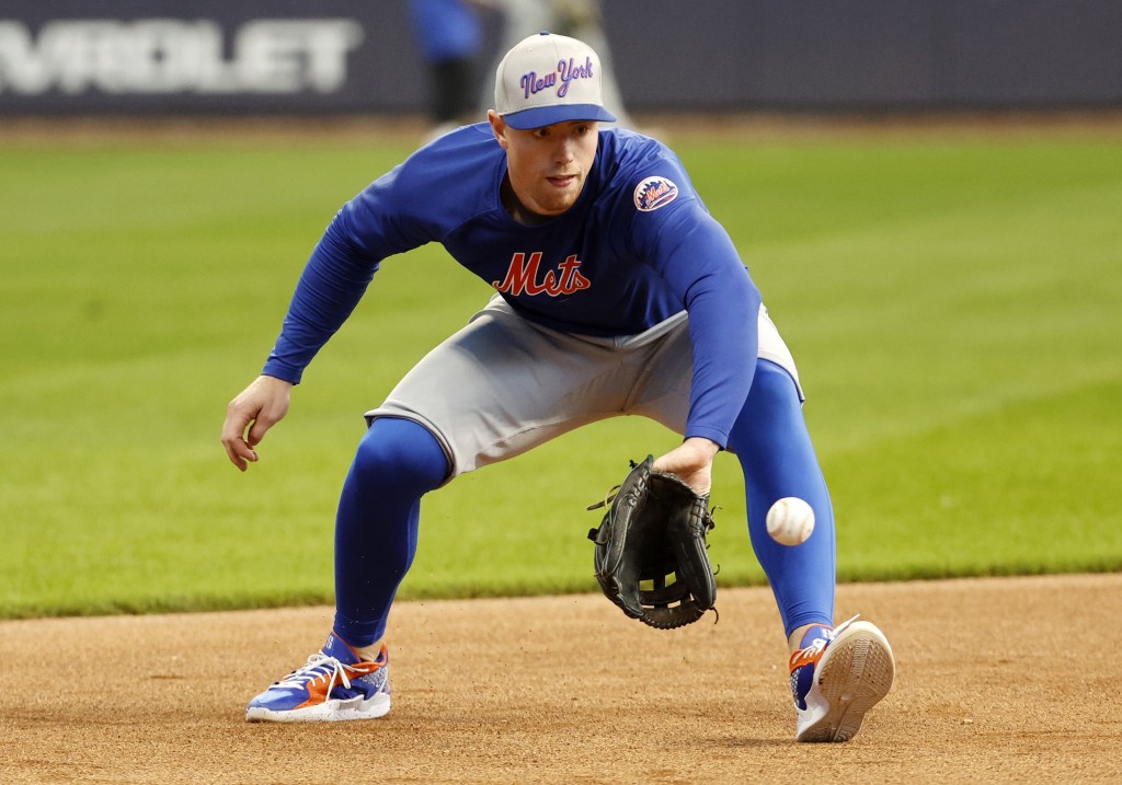 Brett Baty, who is on the Mets' taxi squad, fields a ground ball before the Game 1 against the Brewers.