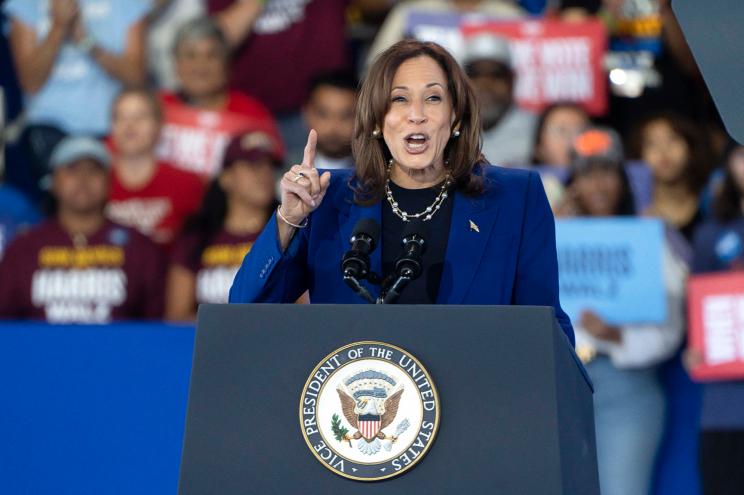 Vice President and Democratic presidential candidate Kamala Harris gestures as she speaks during a campaign rally at Talking Stick Resort Amphitheatre in Phoenix, Arizona, on October 31, 2024.