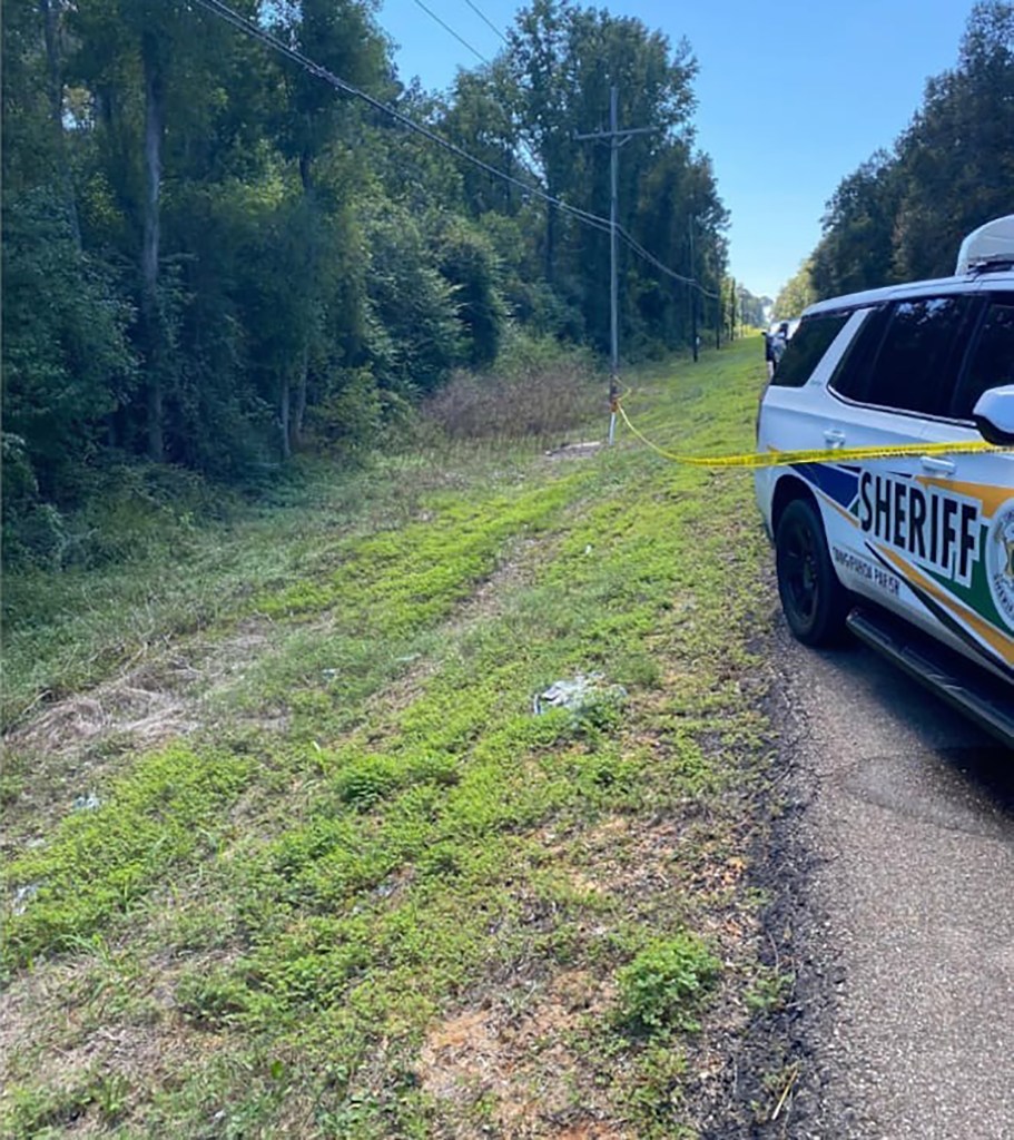 Police vehicle near the side of the road.