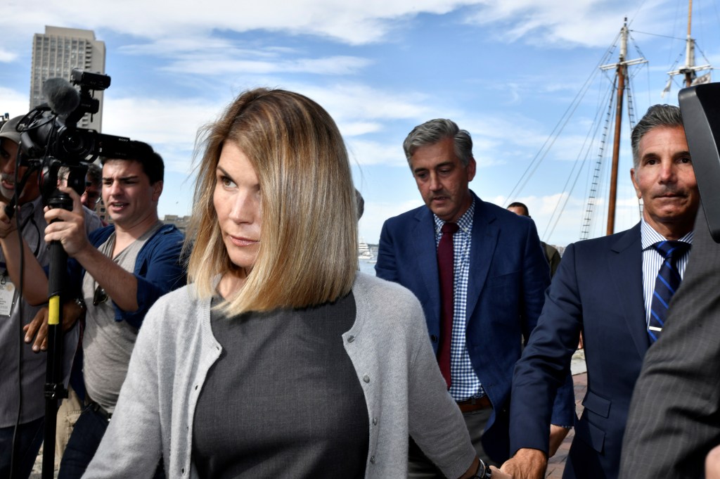 Actress Lori Loughlin and her husband Mossimo Giannulli leave court following a hearing on Aug. 27, 2019.