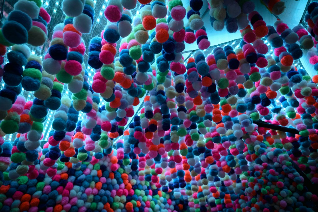 An explosion of pom-poms and color greet visitors.