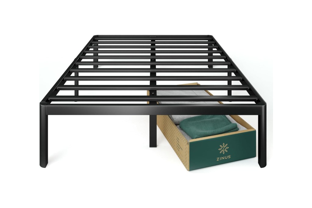 A bed frame with a box of clothes