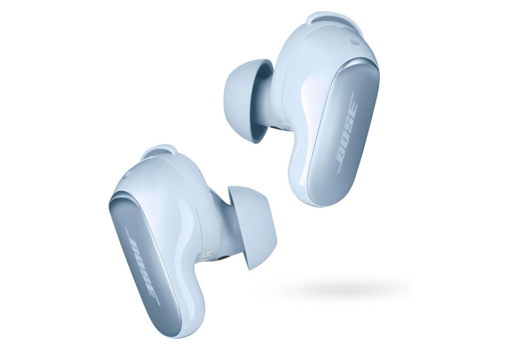 A pair of white Bose earbuds