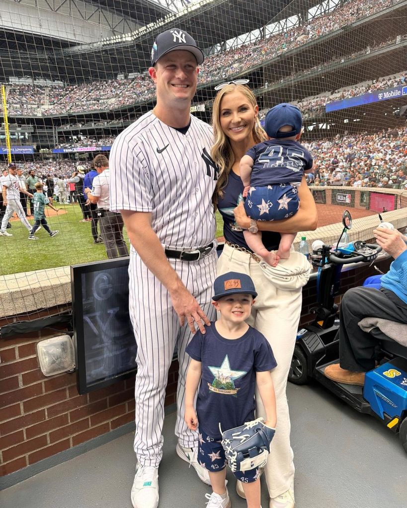 Gerrit Cole smiles with wife Amy and their young sons.