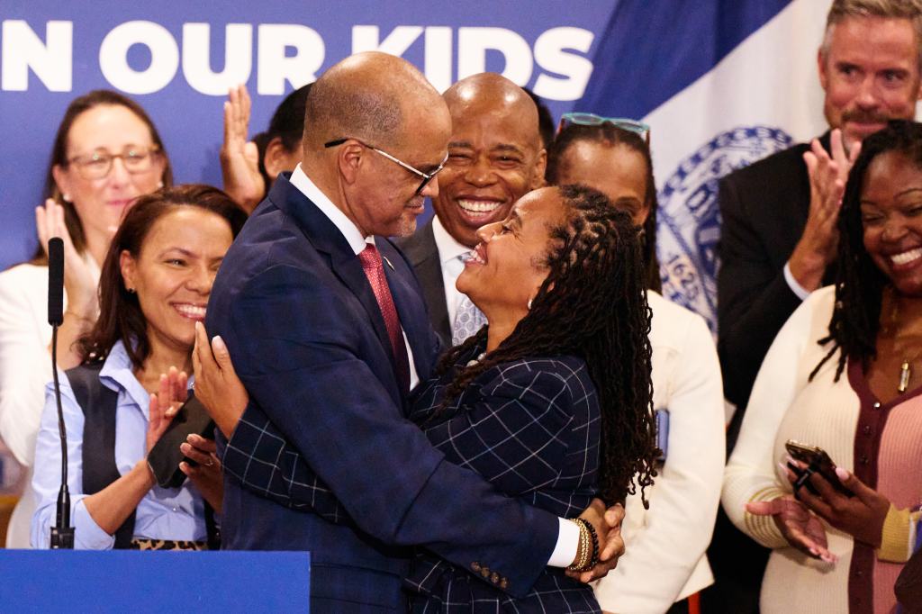 Chancellor David Banks and First Deputy Mayor Sheena Wright embrace at a rally.