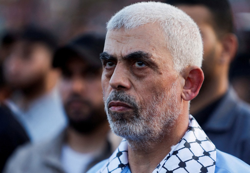 Hamas leader Yahya Sinwar looks on as Palestinian Hamas supporters take part in an anti-Israel rally over tension in Jerusalem's Al-Aqsa mosque