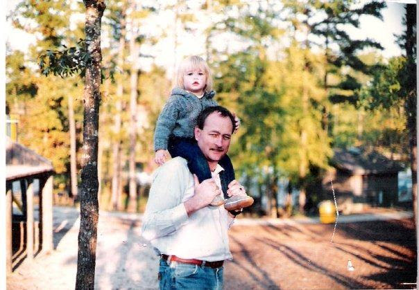 Youn Lauren Sisler sitting on her dad's shoulders