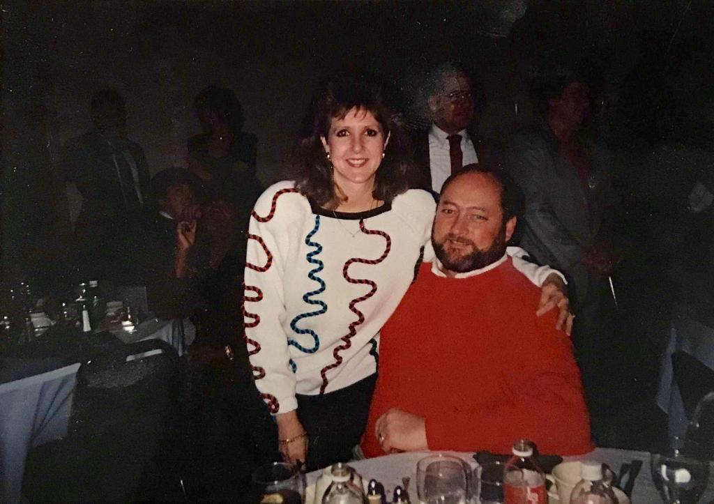 Lesley, standing, and George Sisler, sitting, with their arms around each other