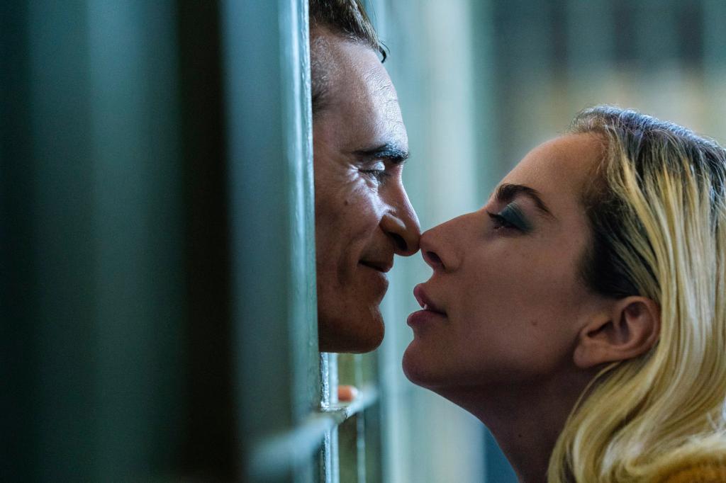 Joaquin Phoenix and Lady Gaga kissing in jail