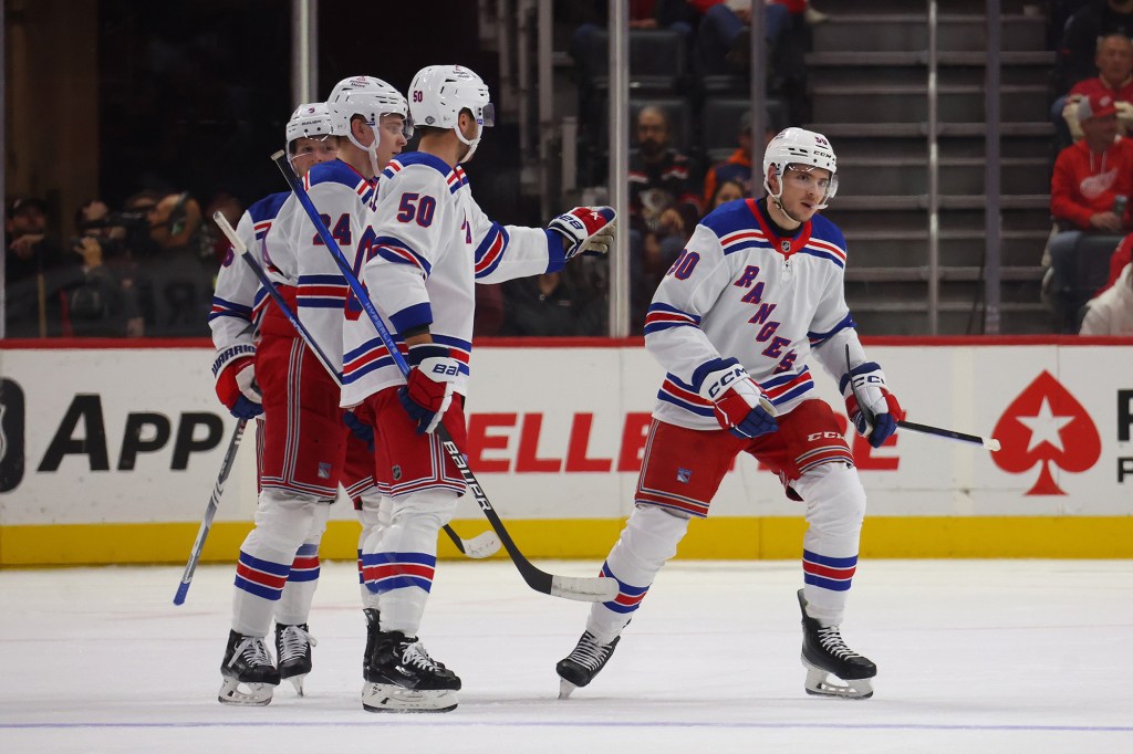 Victor Mancini (r.) collected his first NHL point during the Rangers' win against the Red Wings.