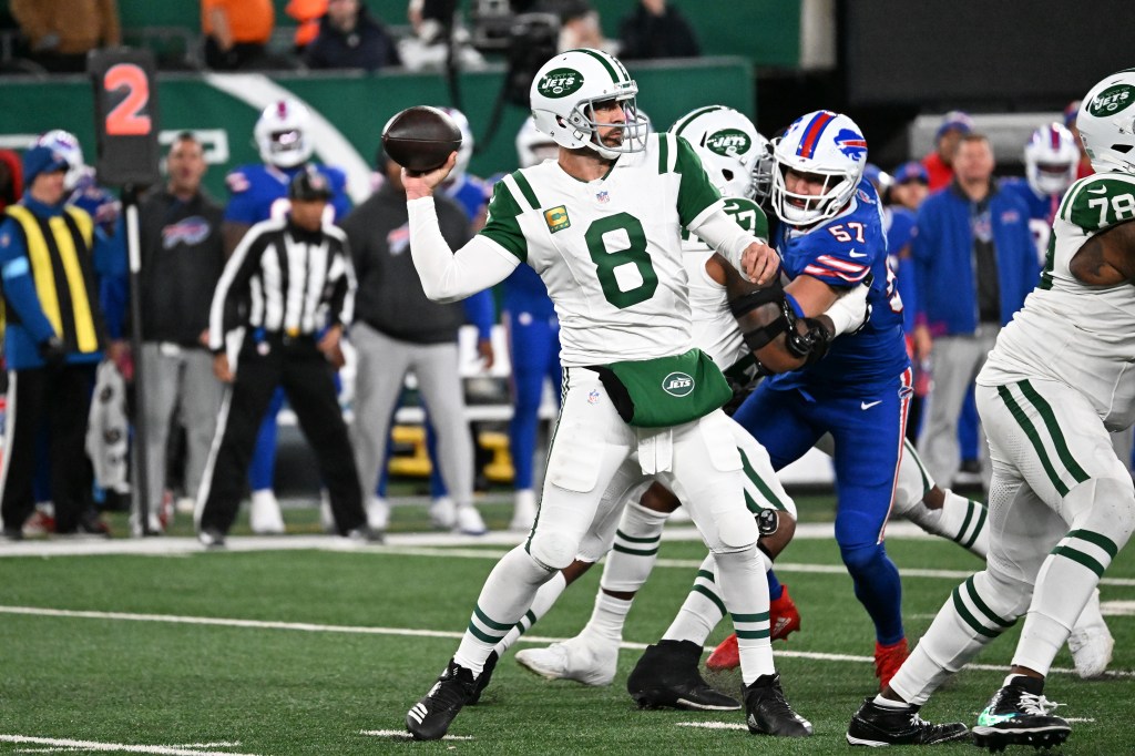 Aaron Rodgers (8) throws a pass against the Bills on Oct. 14, 2024.