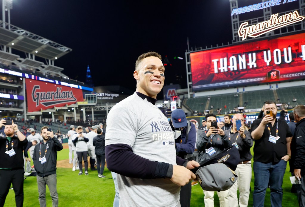 Aaron Judge celebrates on the field after the Yankees win the AL pennant in Cleveland on Oct. 19, 2024.