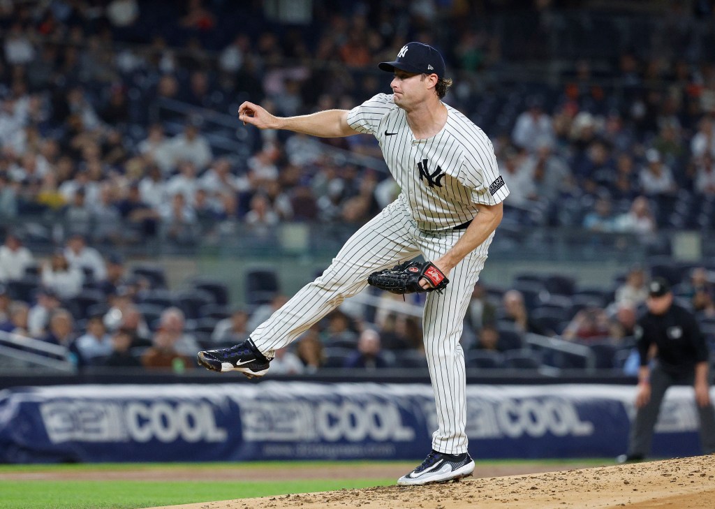 Yankees starting pitcher Gerrit Cole #45 throws a pitch