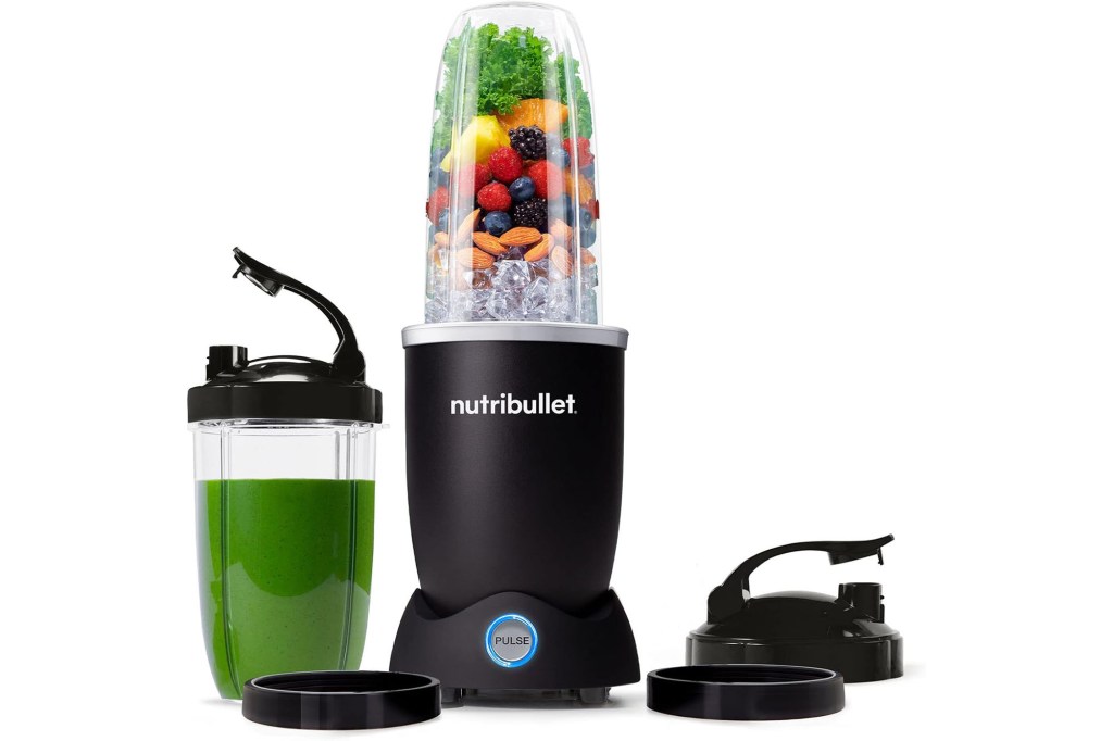 Mike Haynes next to a Nutribullet blender with a green smoothie