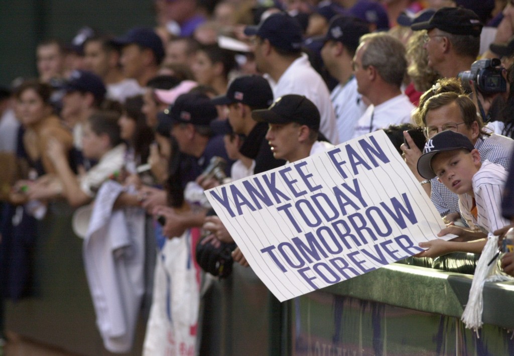 Gerrit Cole holds a Yankee sign during the 2001 World Series.