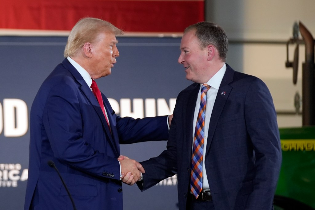 Donald Trump greets Lee Zeldin as he arrives to speak at a campaign event at a farm, Monday, Sept. 23, 2024, in Smithton, Pa.