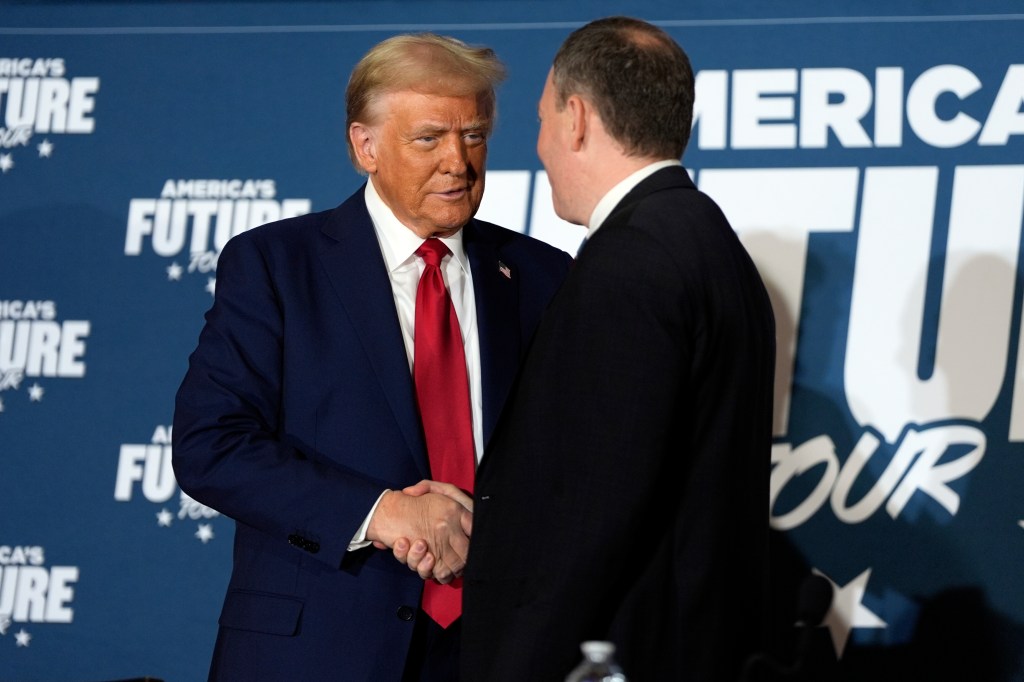 Donald Trump shakes hands with former Rep. Lee Zeldin, R-N.Y., during a roundtable at the Drexelbrook Catering & Event Center, Tuesday, Oct. 29, 2024, in Drexel Hill, Pa.