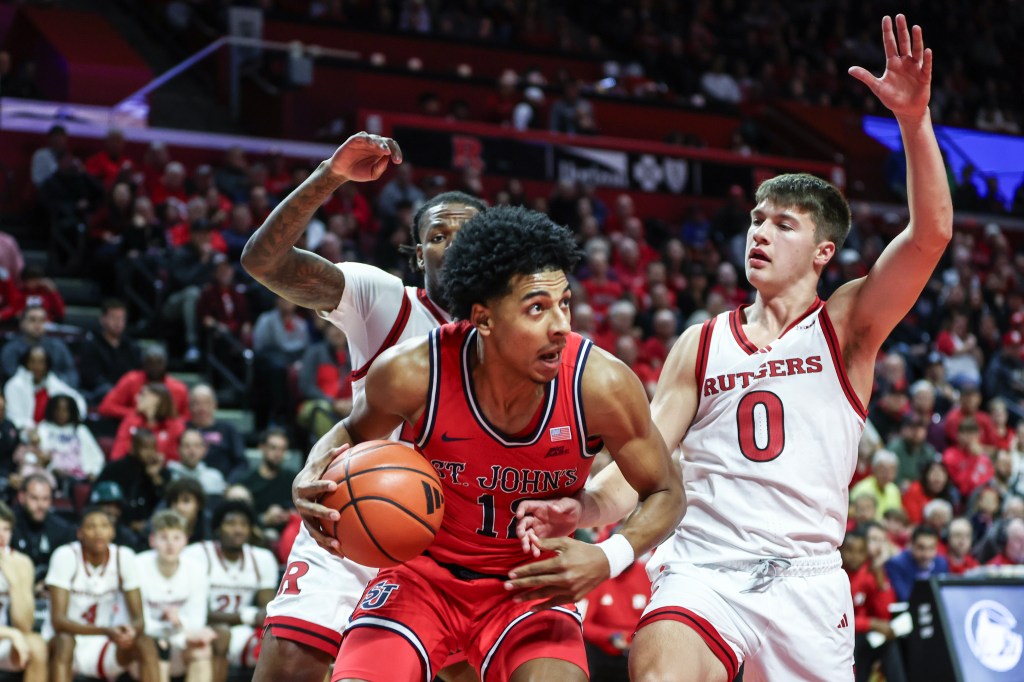 St. John's Red Storm guard RJ Luis Jr. (12) looks to drive past Rutgers Scarlet Knights guard Jordan Derkack (0) in the first half at Jersey Mike's Arena. 