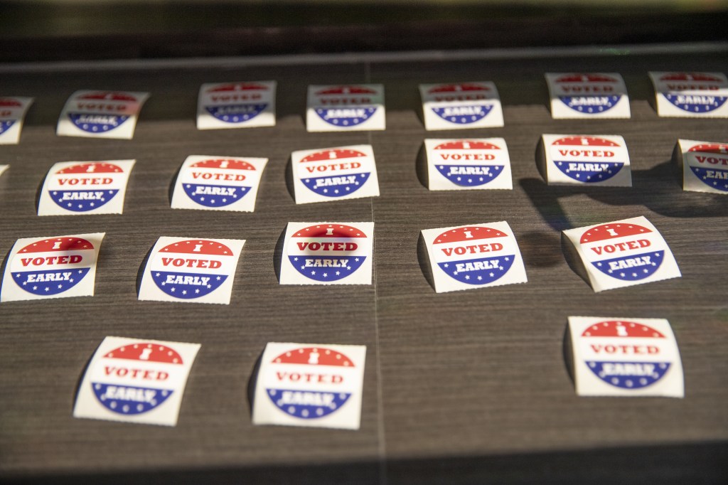 Stickers sit at a table next to the exit at the Minneapolis, Minnesota, United States on September 20, 2024.