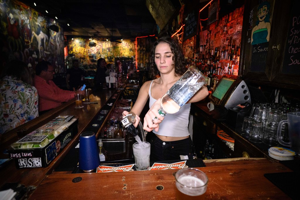 Ayah Nuwwarah tends bar at the Double Down Saloon.