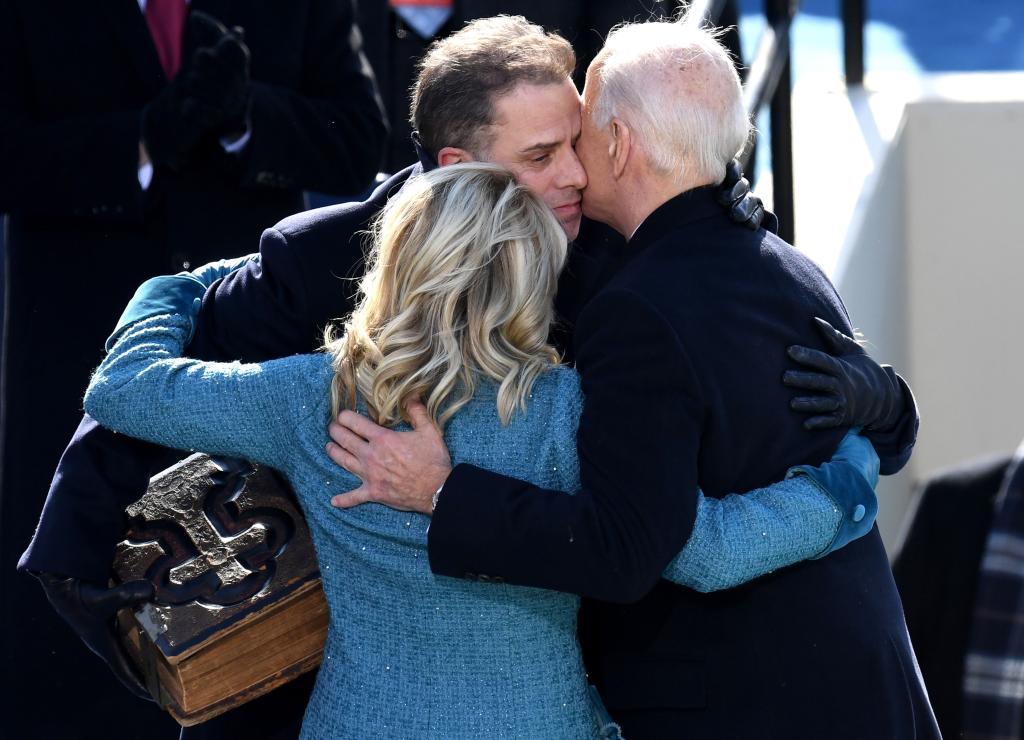 Hunter BIden hugs Joe Biden and Jill Biden.