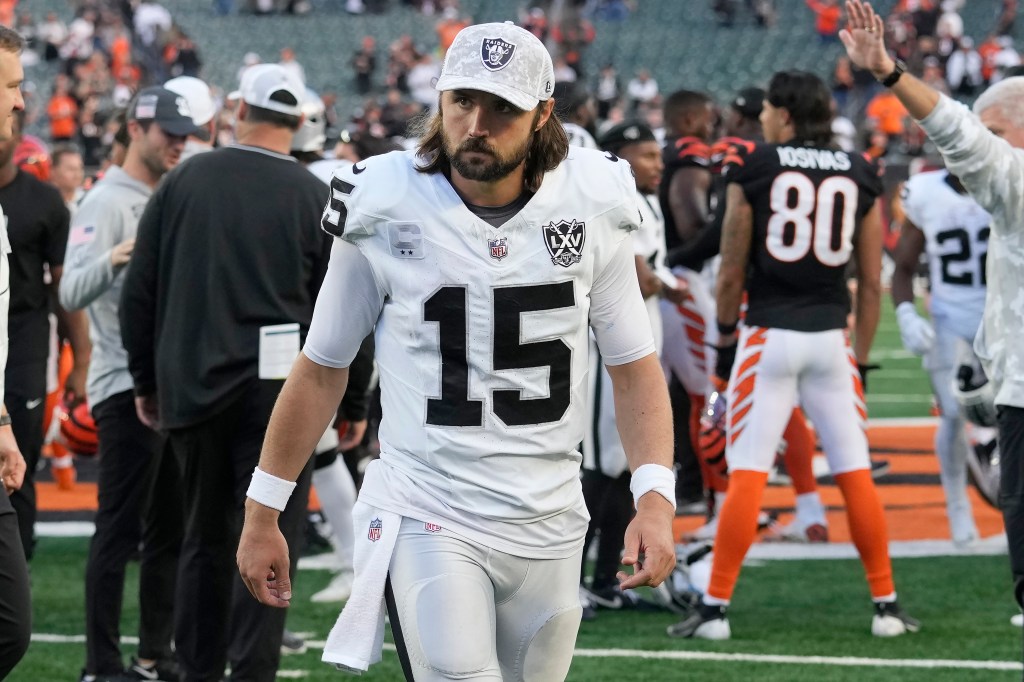 Gardner Minshew II in white Raiders uniform walking off the field after a game against the Cincinnati Bengals on Nov. 3, 2024