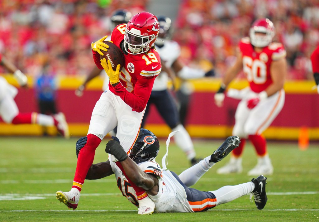 Chiefs wide receiver Kadarius Toney (19) is tackled by Chicago Bears linebacker Amen Ogbongbemiga (45) during the first half at GEHA Field at Arrowhead Stadium in August 2023.