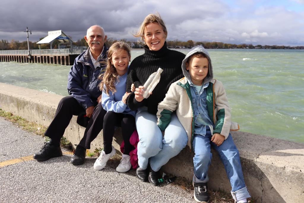 Makenzie said she'd always wondered whether someone would find the note. Left to right: Makenzie's former teacher Roland St. Pierre,  Scarlet Van Eyk (daughter), Makenzie Van Eyk (formerly Morris), and her son (not named).