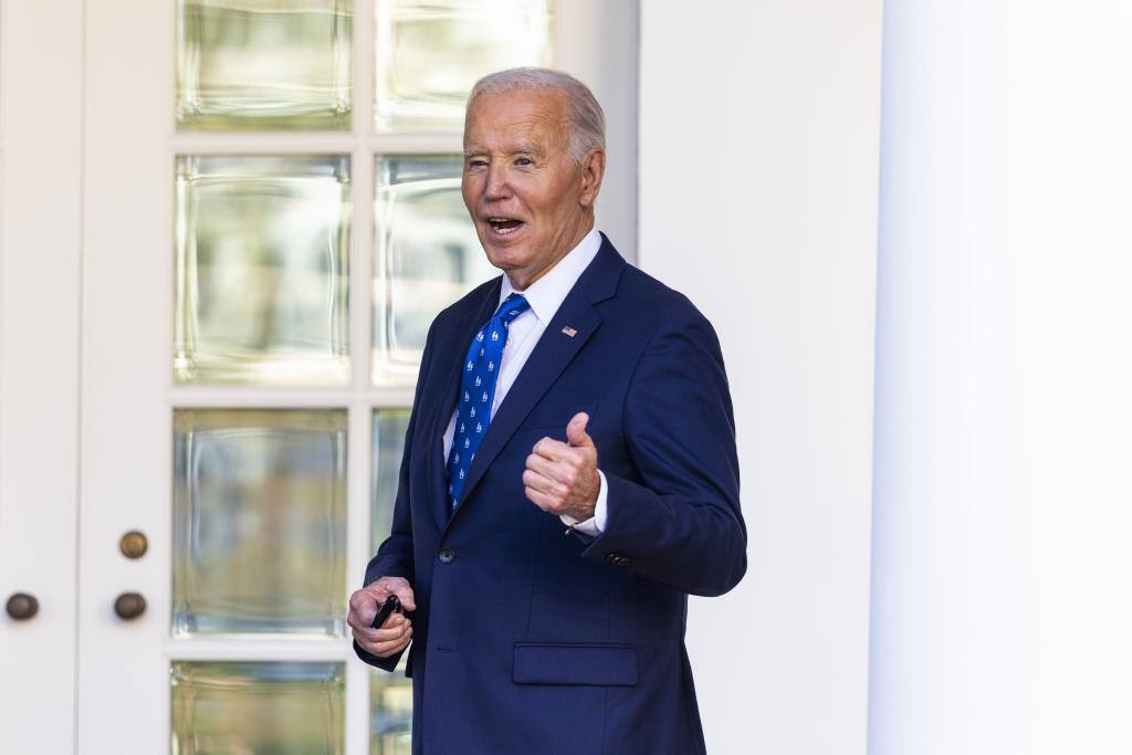 President Biden gives a thumbs up in the Rose Garden