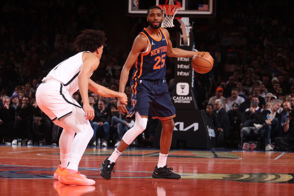 Mikal Bridges of the New York Knicks dribbling the ball during a game against the Brooklyn Nets at Madison Square Garden, November 2024.