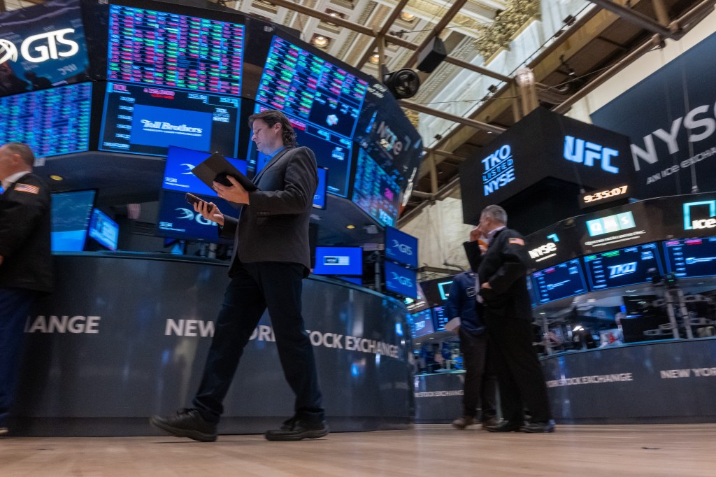 Traders work on the New York Stock Exchange (NYSE) floor on November 12, 2024 in New York City.