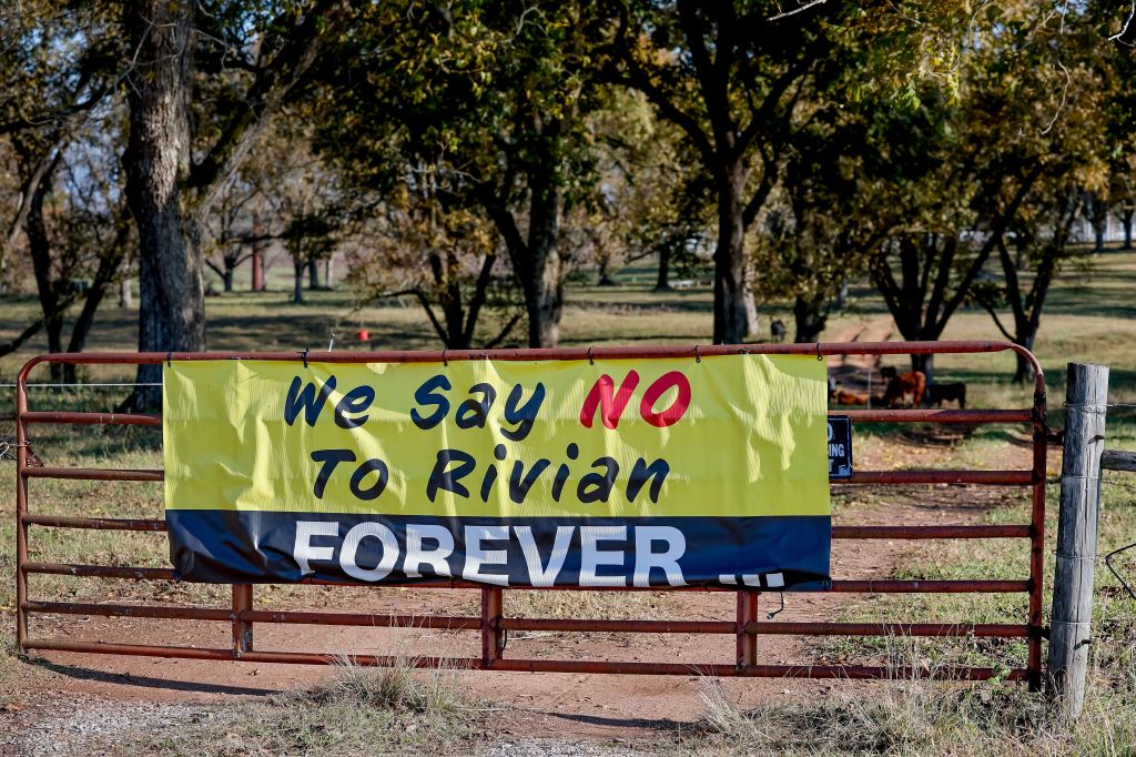 Protest banner next to the proposed site of the Rivian electric vehicle assembly plant in Social Circle, Georgia