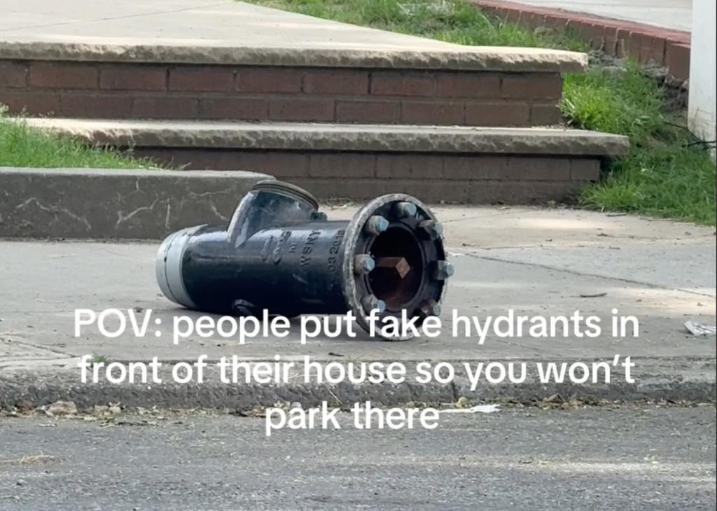 Screenshot from a 2024 TikTok post by i.beautifull Bee Smith OTR/L, showing a black fake fire hydrant fallen over on the sidewalk.